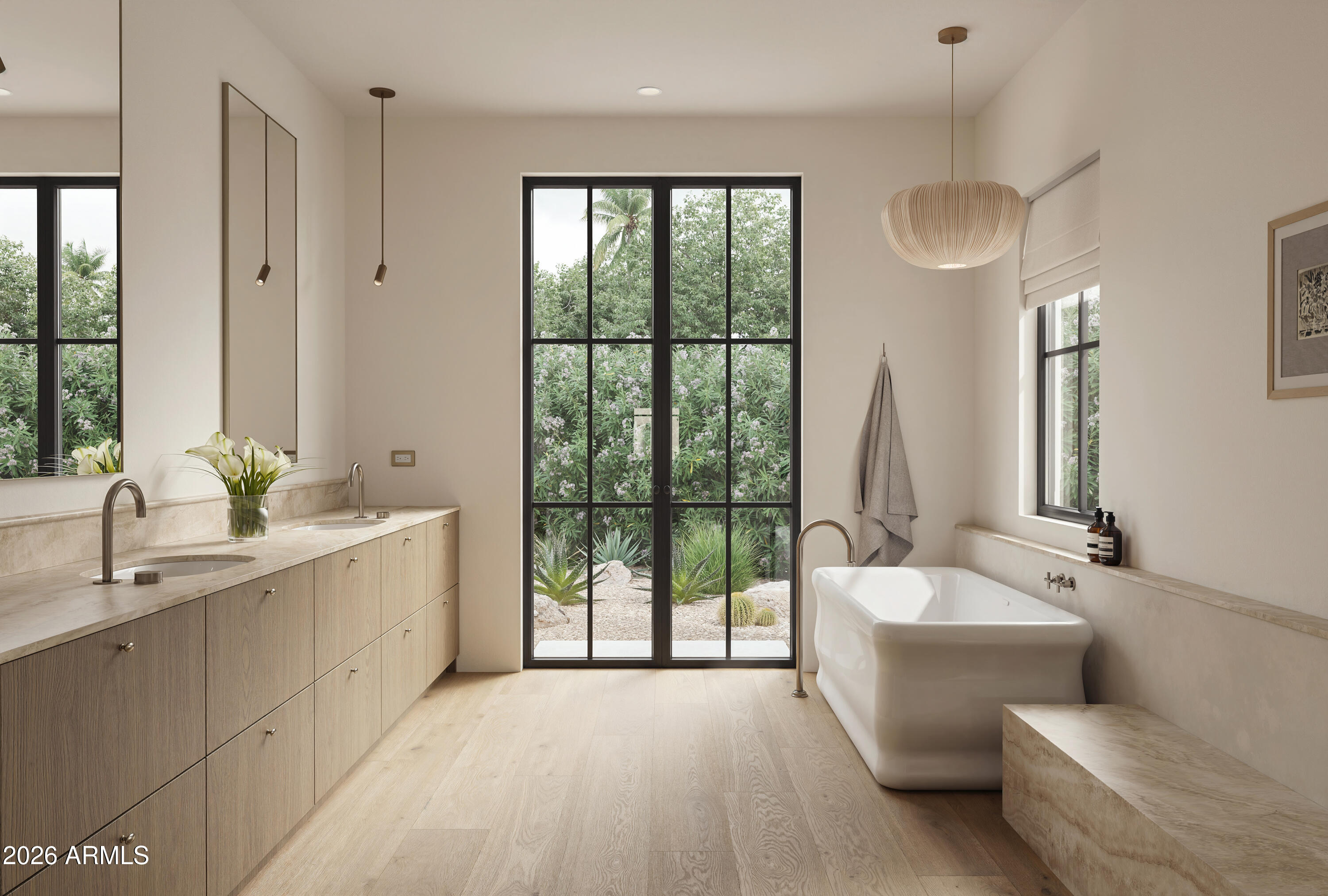 Bathroom with a freestanding soaking tub and double vanity beside black-framed garden doors.