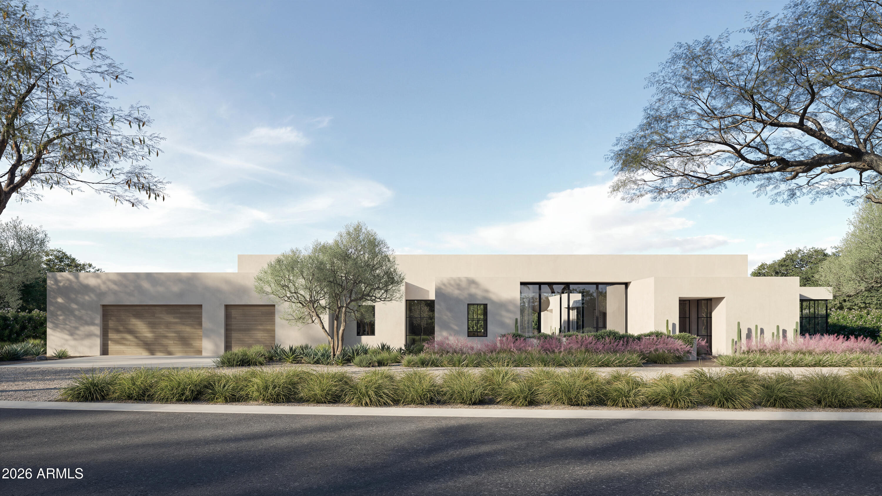 Modern single-story home with pale stucco, wood-tone garage doors, broad windows, and desert landscaping.