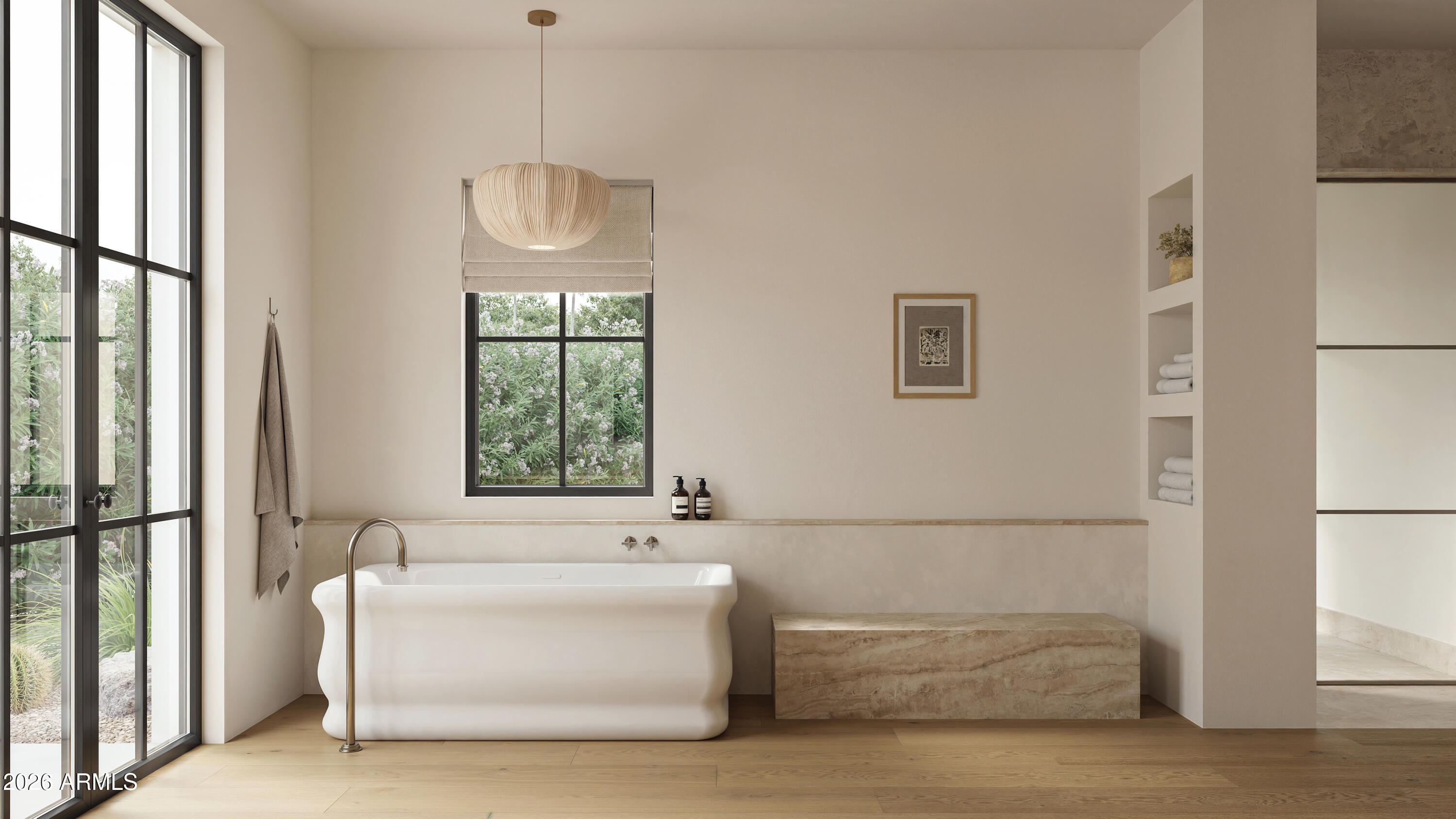 Bathroom with a freestanding tub, stone bench, and tall black-framed windows overlooking greenery.