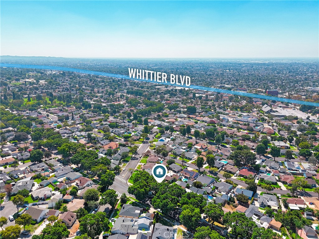Aerial view of the home’s leafy residential neighborhood, with Whittier Boulevard labeled in the distance.