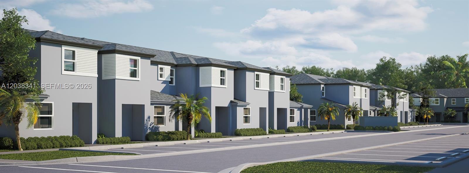 Row of modern two-story townhouses with palm trees and parking spaces.