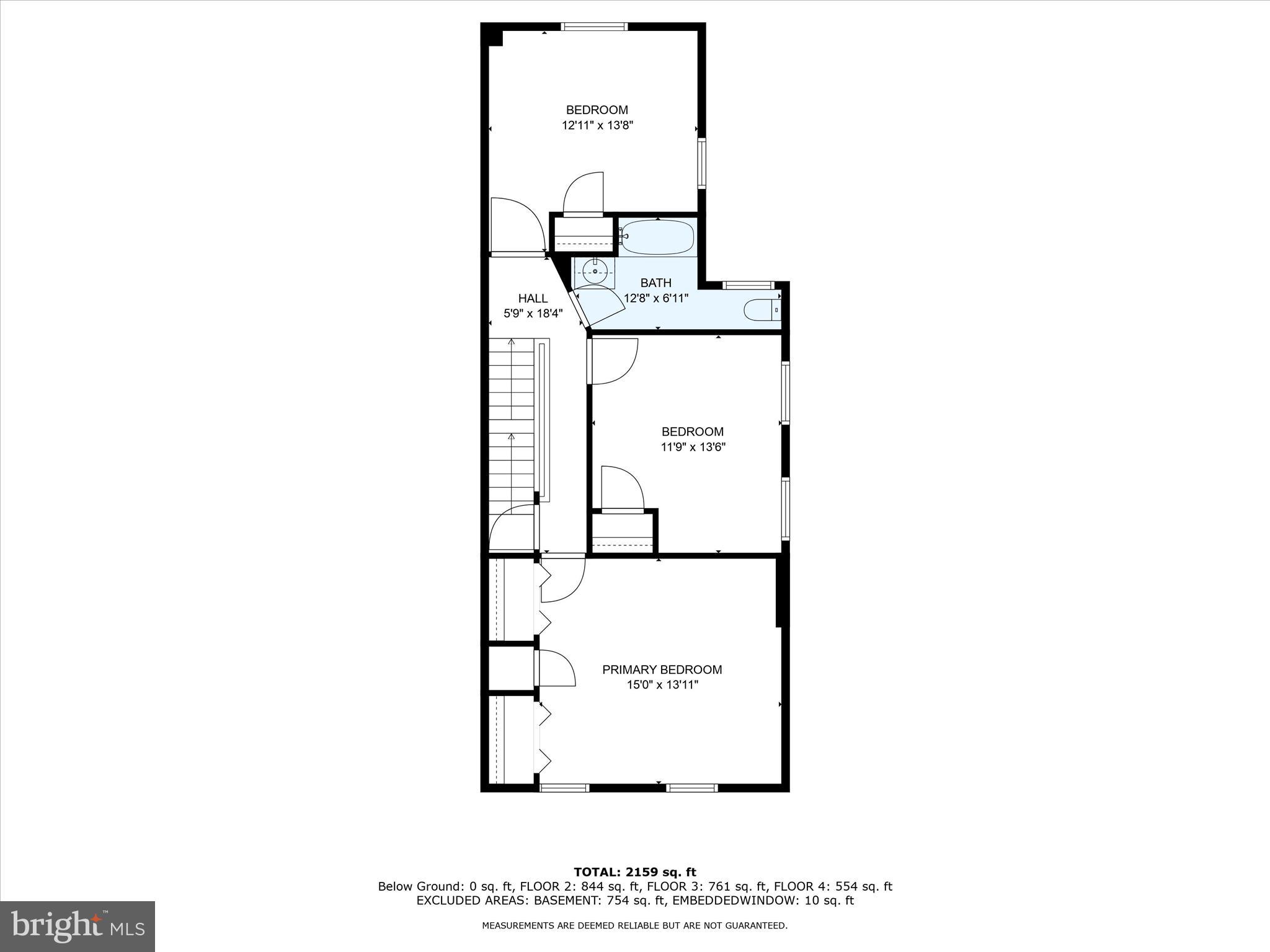 Floor plan showing a primary bedroom, two bedrooms, a bathroom, hall, and staircase.