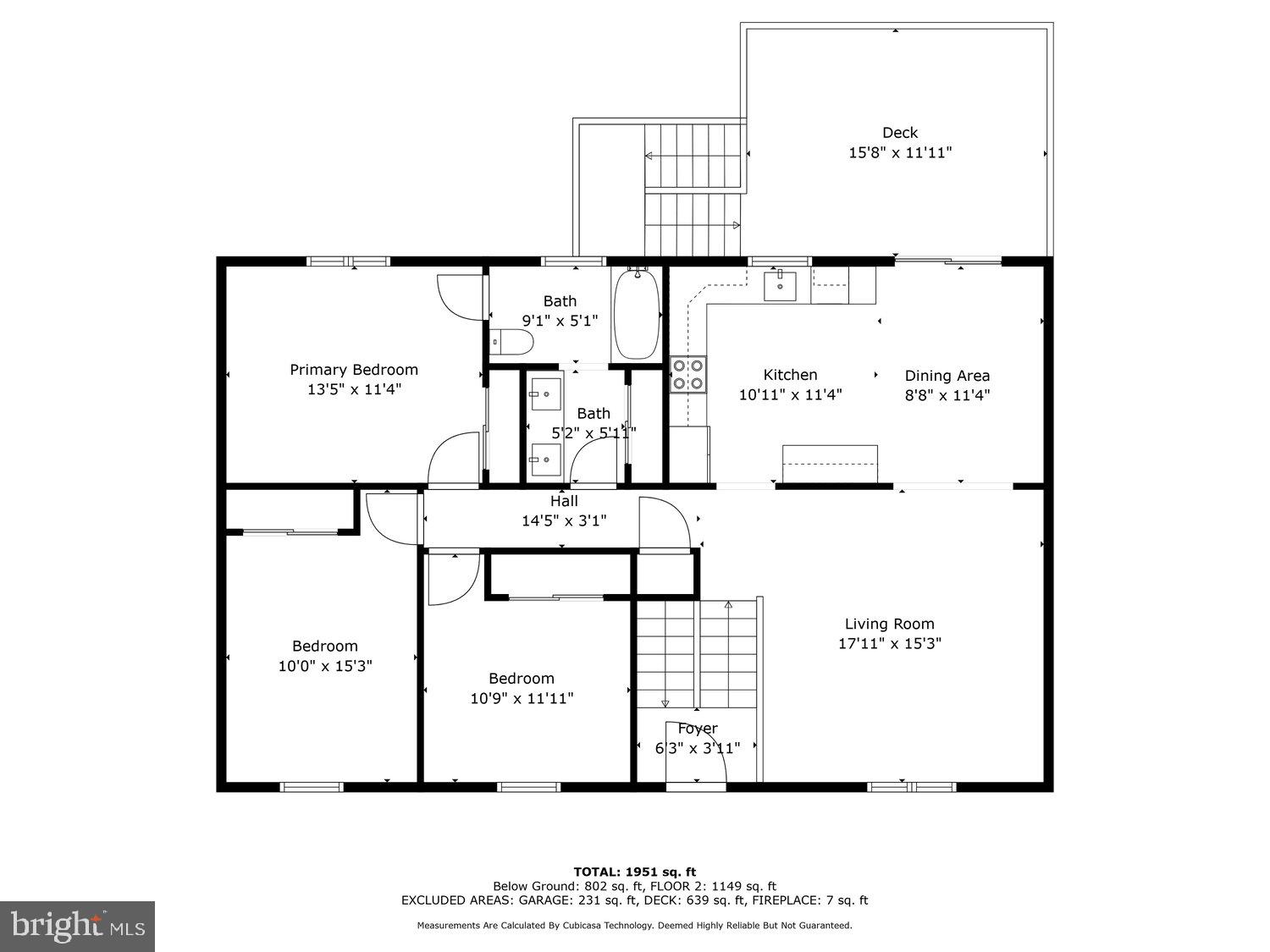 Floor plan showing three bedrooms, two baths, living and dining areas, kitchen, and a large deck.