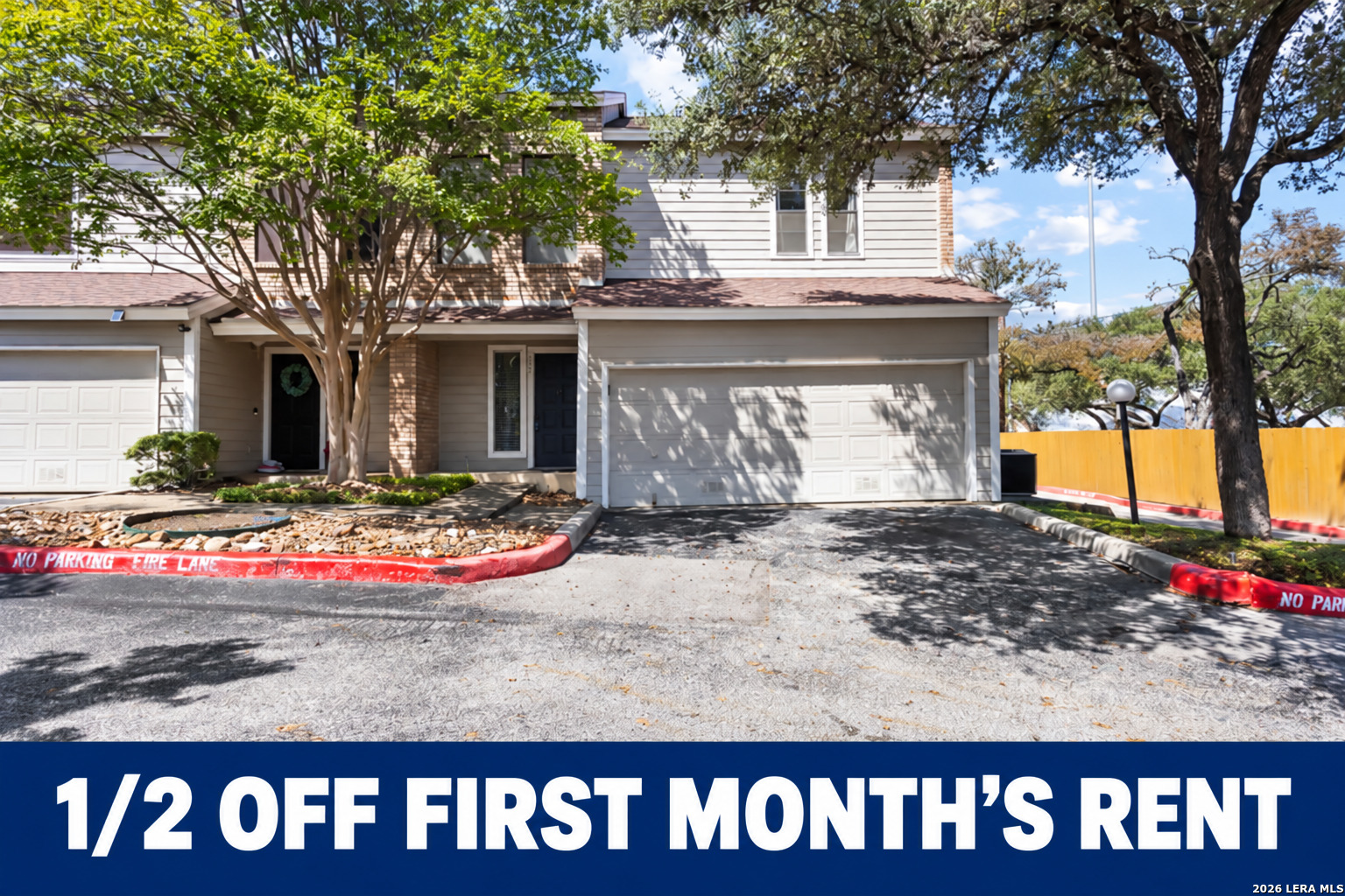 Rental promotion featuring a two-story home and an offer of half off the first month’s rent.
