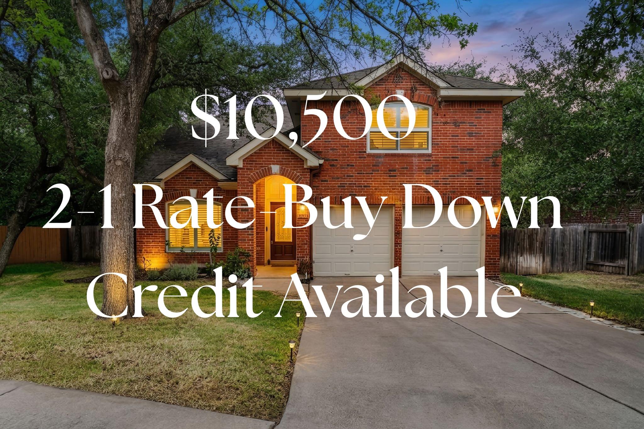 Two-story red brick house with a two-car garage; overlay advertises a $10,500 2-1 rate buy down credit.