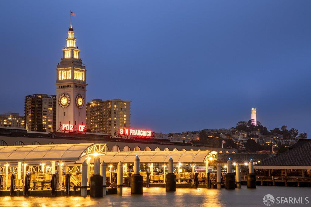San Francisco waterfront and Ferry Building illuminated at dusk.