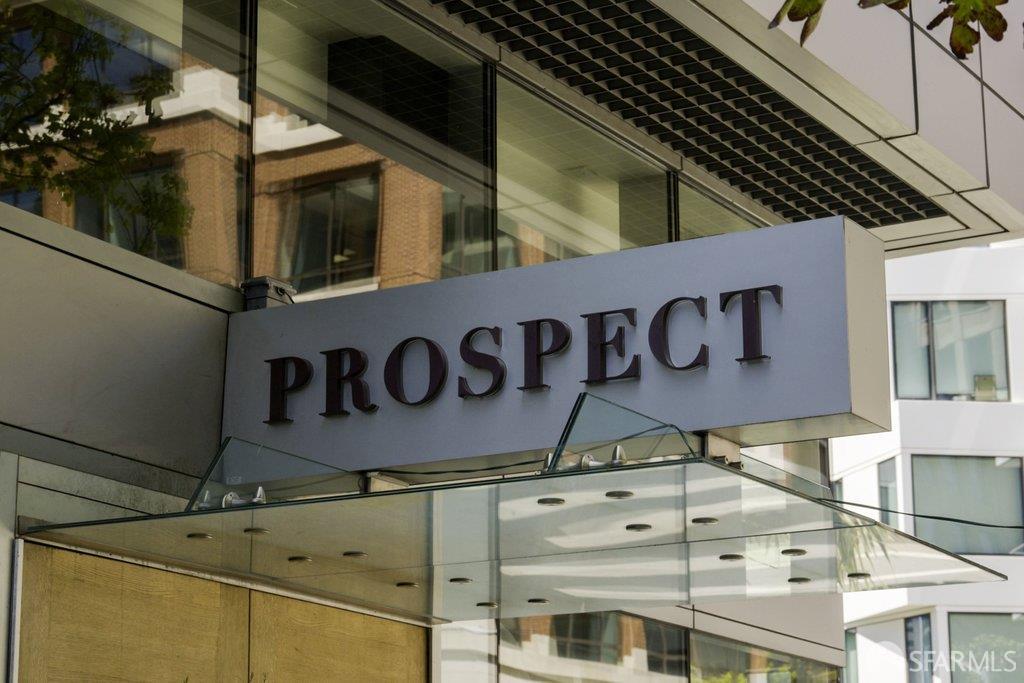 Modern building exterior with a prominent PROSPECT sign above a glass entrance canopy.