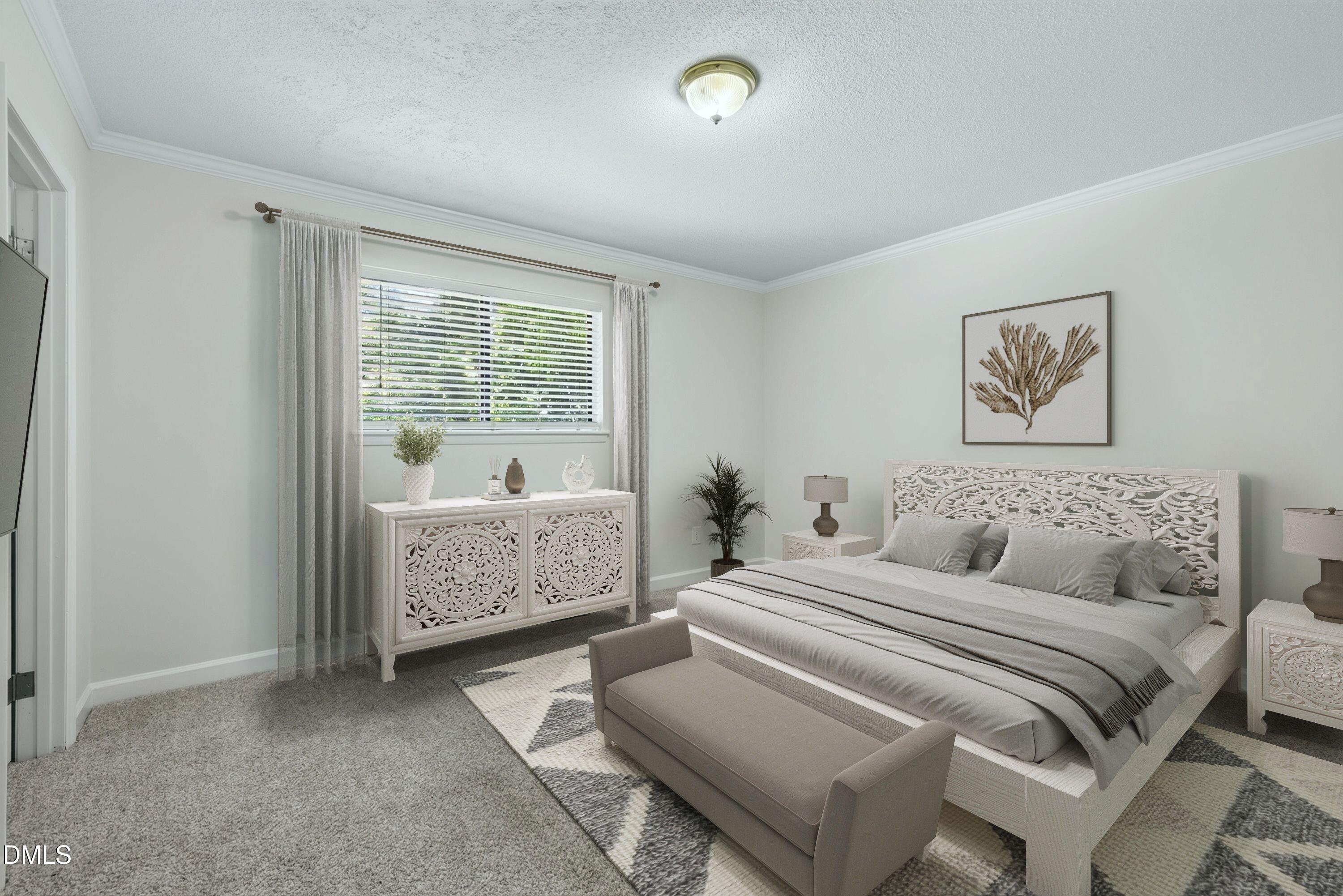 Bedroom with a white carved bed, gray bedding, matching dresser, and patterned rug.