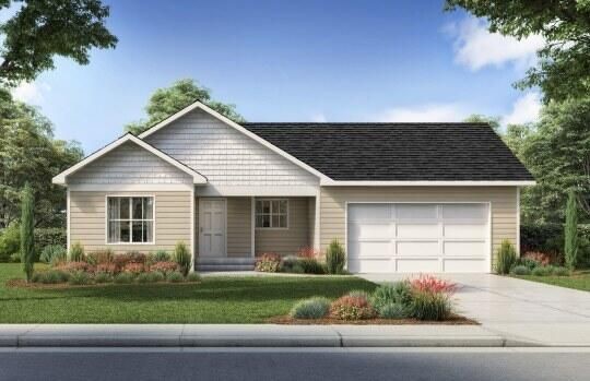 Single-story home with an attached two-car garage and landscaped front yard.