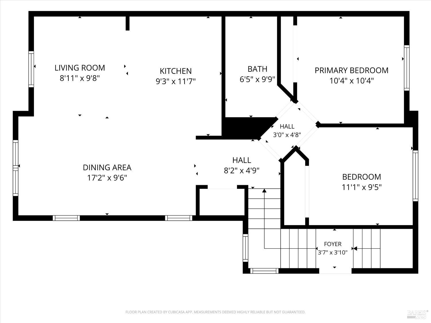 Floor plan showing the living room, kitchen, dining area, two bedrooms, bathroom, halls, and foyer.
