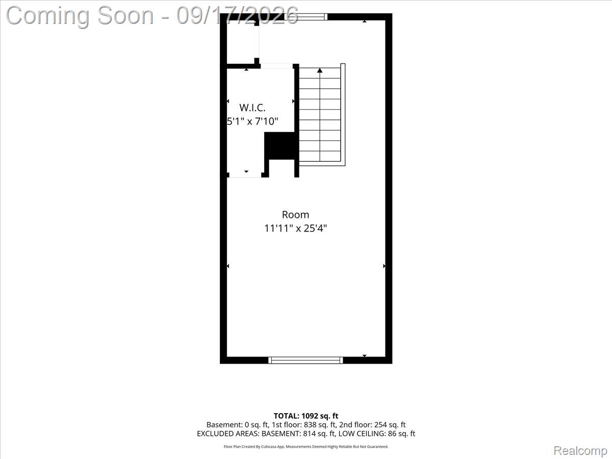 Floor plan showing a long room, walk-in closet, and staircase.