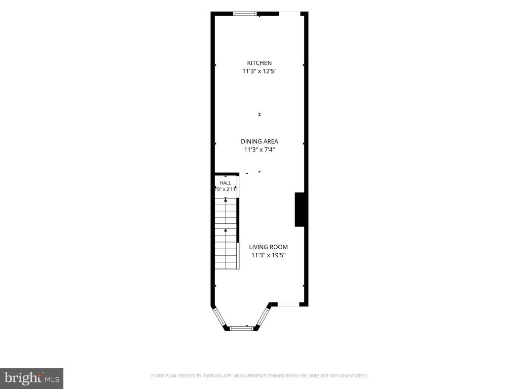 Floor plan showing the kitchen, dining area, hall, stairs, and living room.