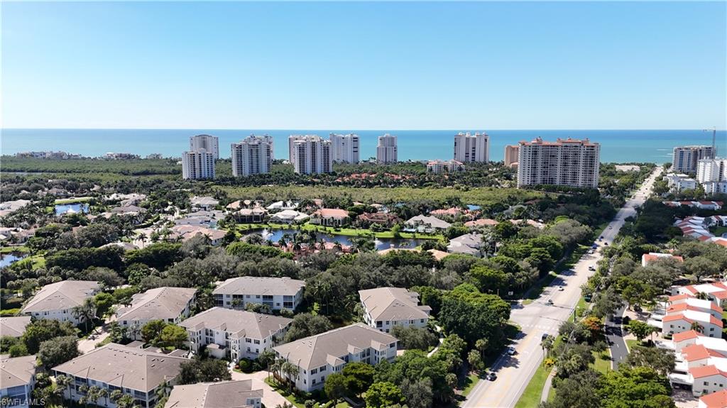 Aerial view of a Naples coastal neighborhood, with high-rises along the Gulf of Mexico.