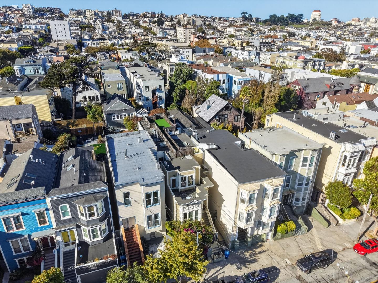 Aerial view of closely packed San Francisco homes and tree-lined streets near 2568 Sutter Street.