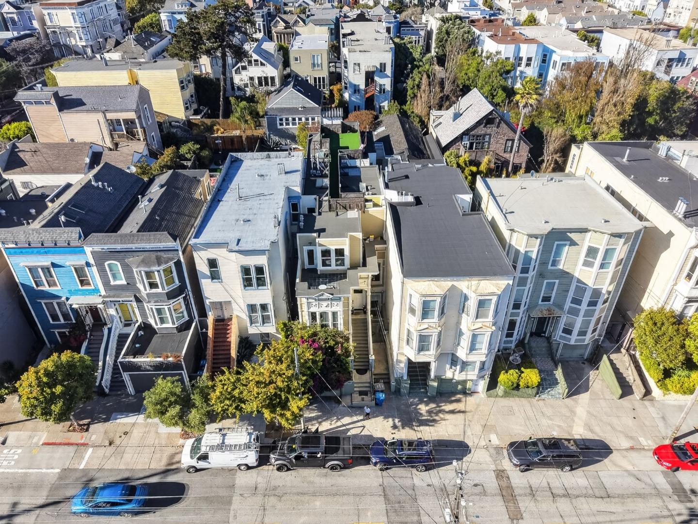 Aerial view of a San Francisco residential block with closely packed homes and varied rooftops.