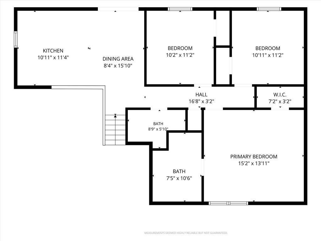 Floor plan showing a kitchen, dining area, three bedrooms, two bathrooms, hall, and walk-in closet.