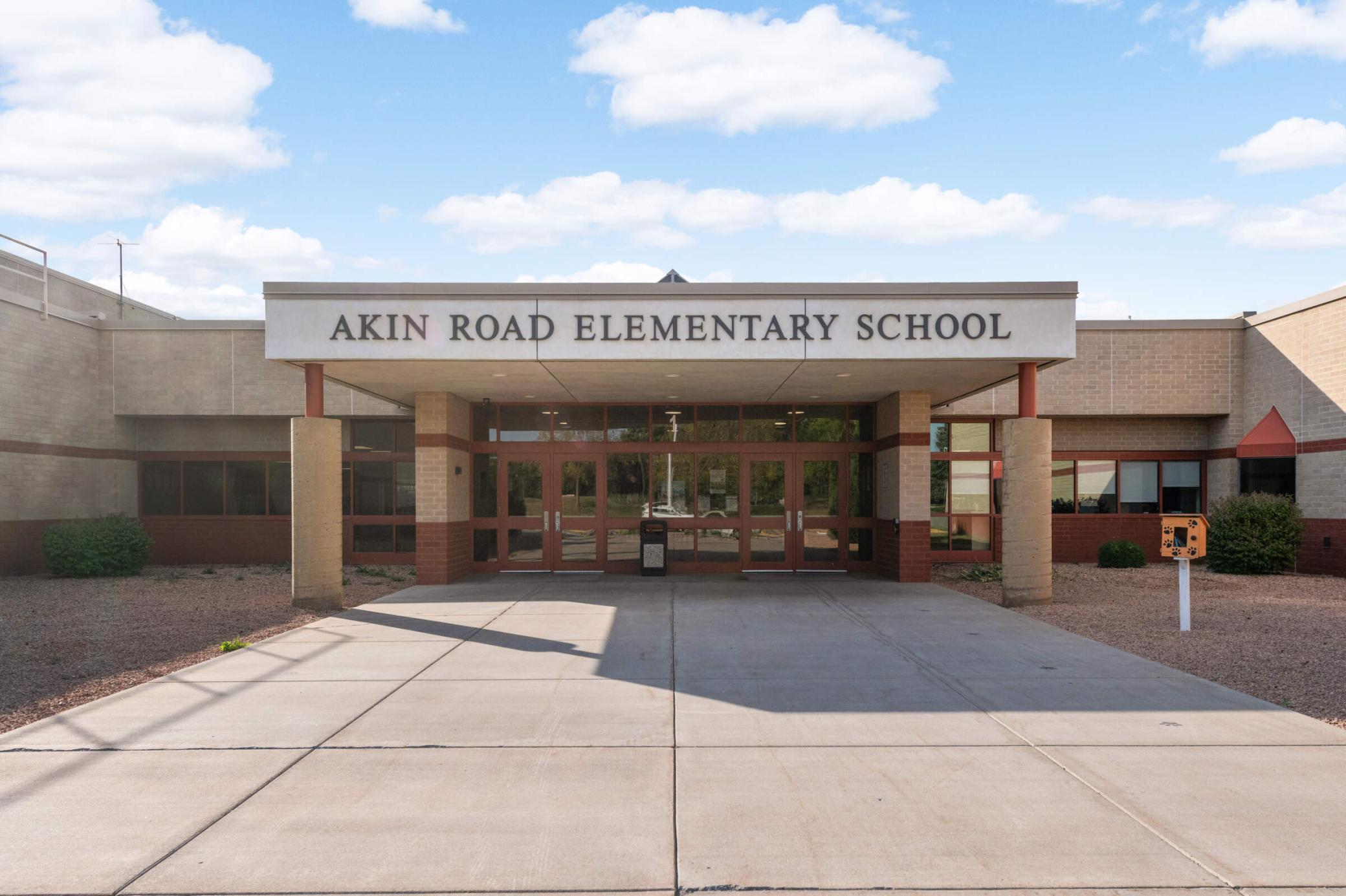Akin Road Elementary School entrance beneath its large name sign.
