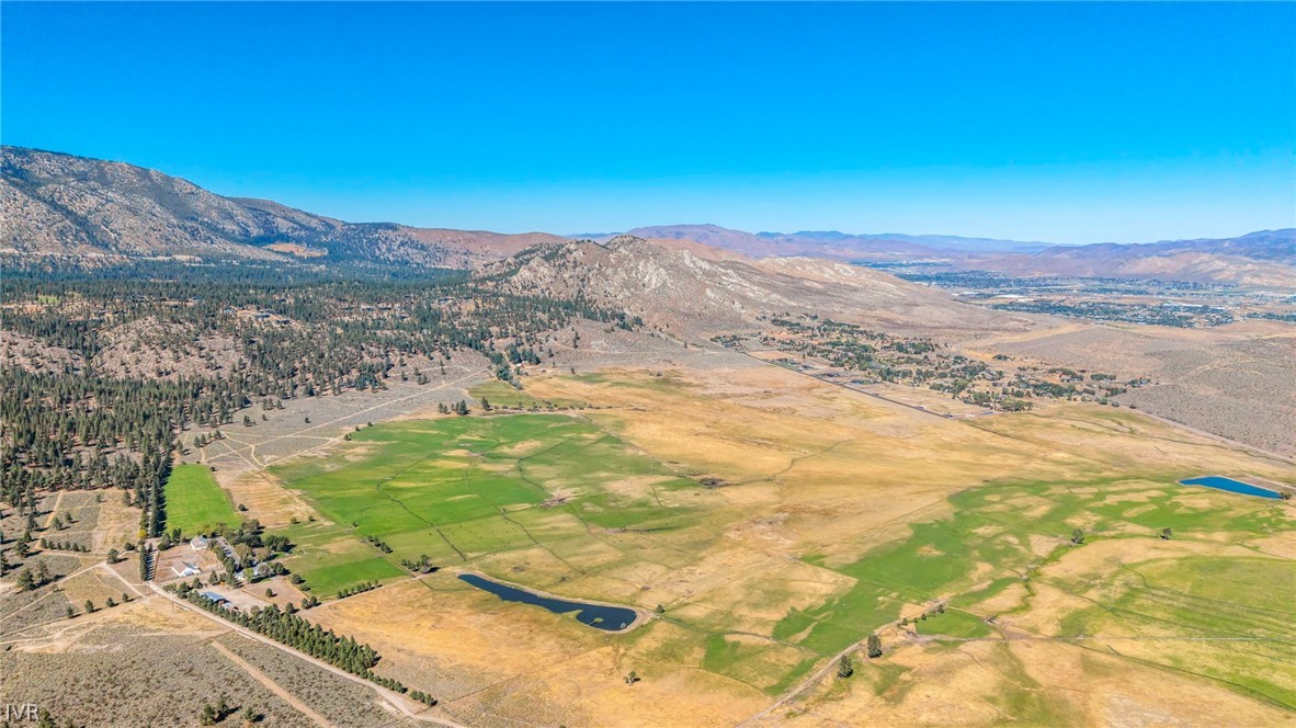 Aerial view of Jacks Valley fields, with surrounding mountains and small ponds.