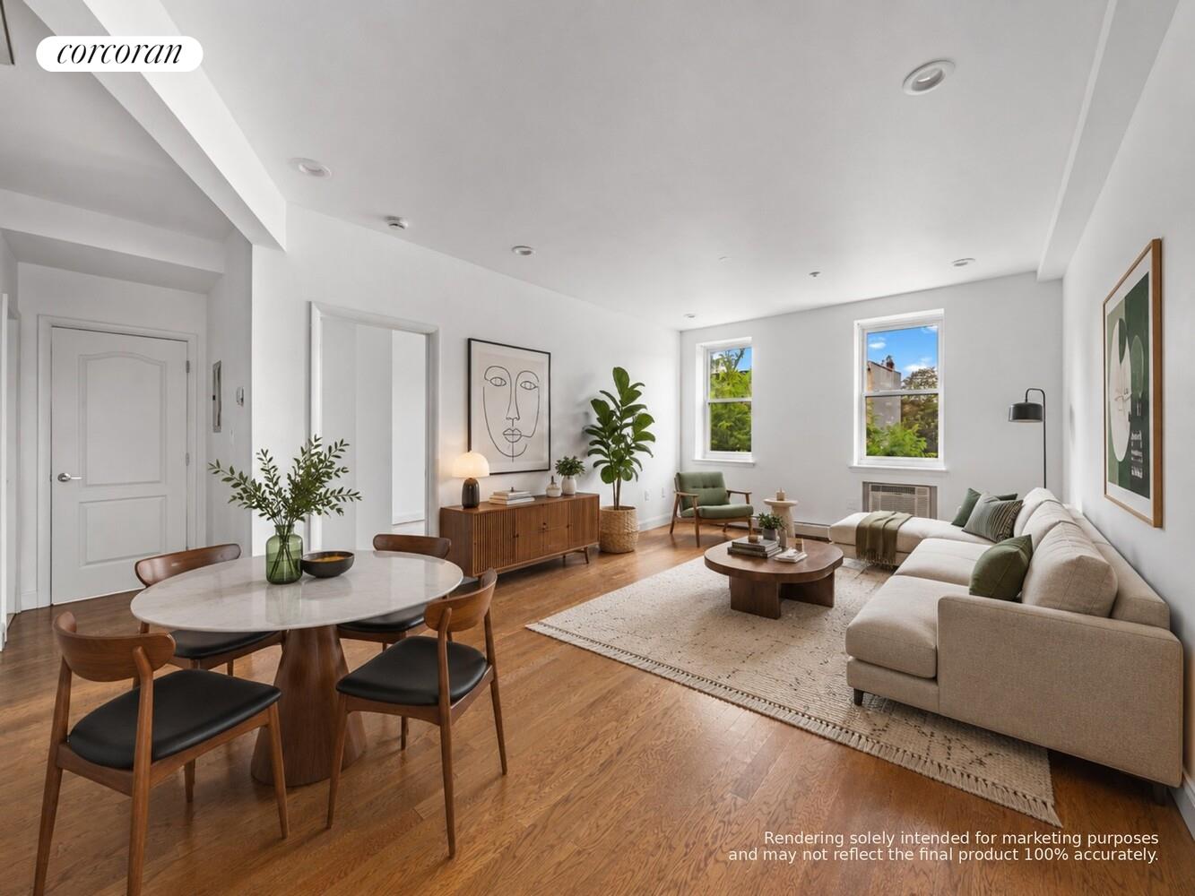 Open-plan living and dining room with hardwood floors, a beige sectional, and large windows.
