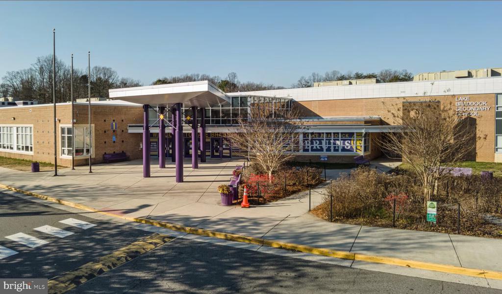 Lake Braddock Secondary School exterior with a glass entrance and purple columns.