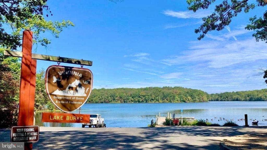 Lake Burke with a boat launch and Virginia wildlife department signs in the foreground.
