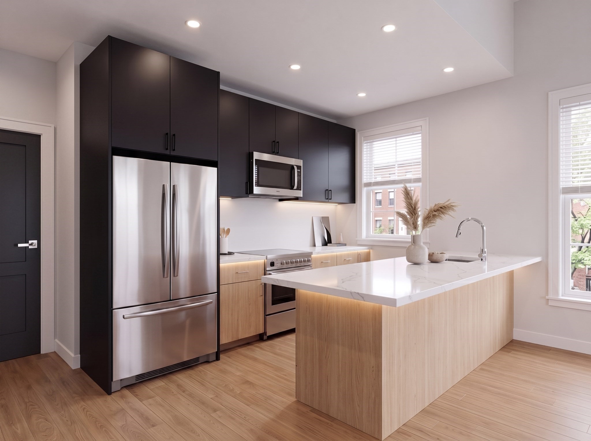Modern kitchen with a large wood island, dark cabinets, and stainless steel appliances.