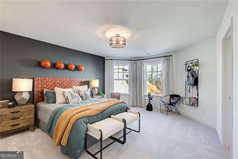 Staged bedroom with basketballs above a cork-and-wood headboard and a bench at the foot of the bed.