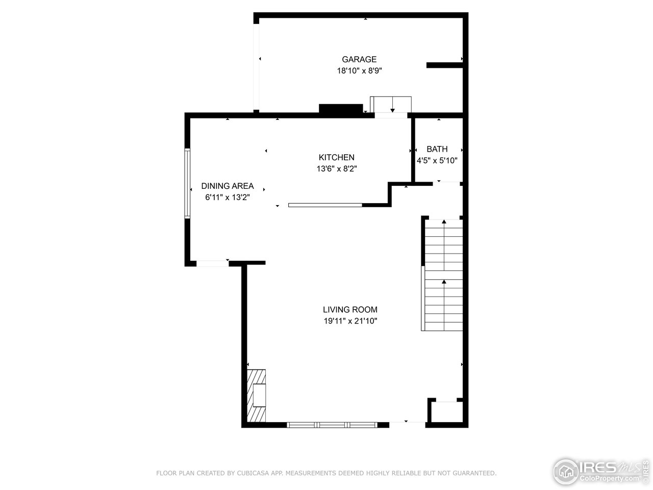 Floor plan showing garage, kitchen, dining area, bathroom, living room, and staircase.