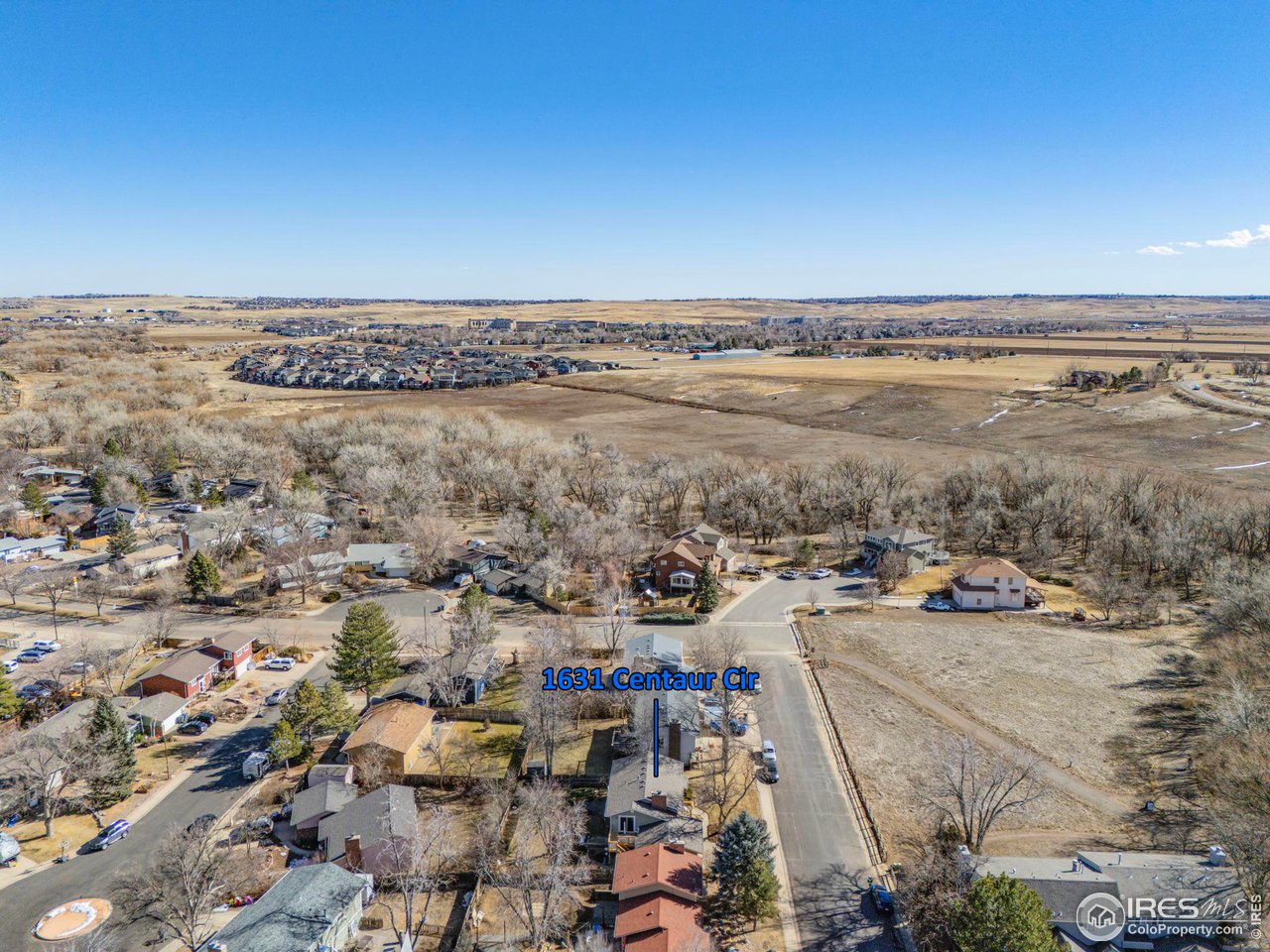 Aerial view of 1631 Centaur Cir, marked among homes near open fields.