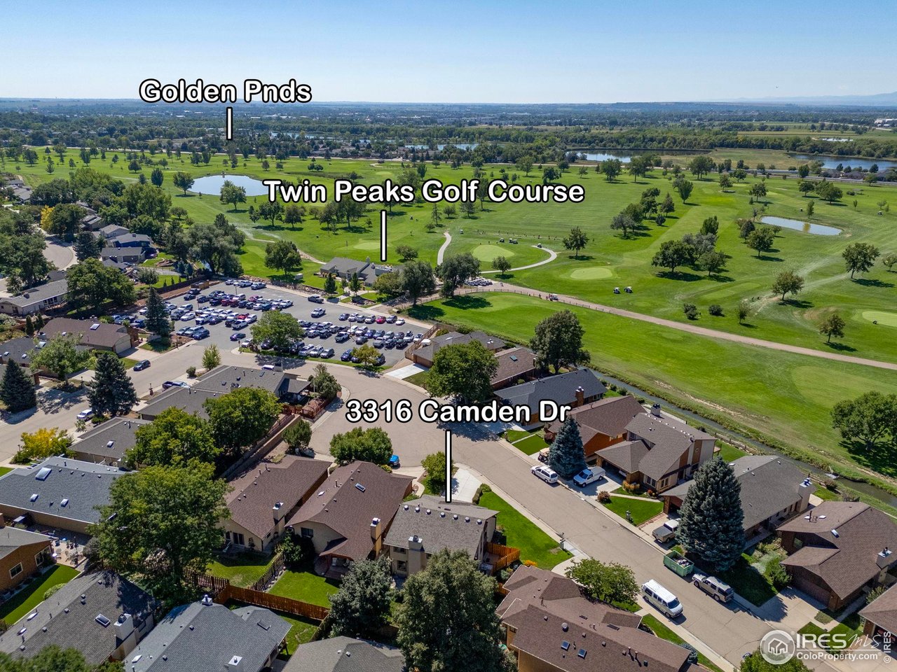 Aerial view of 3316 Camden Dr beside Twin Peaks Golf Course and Golden Ponds.