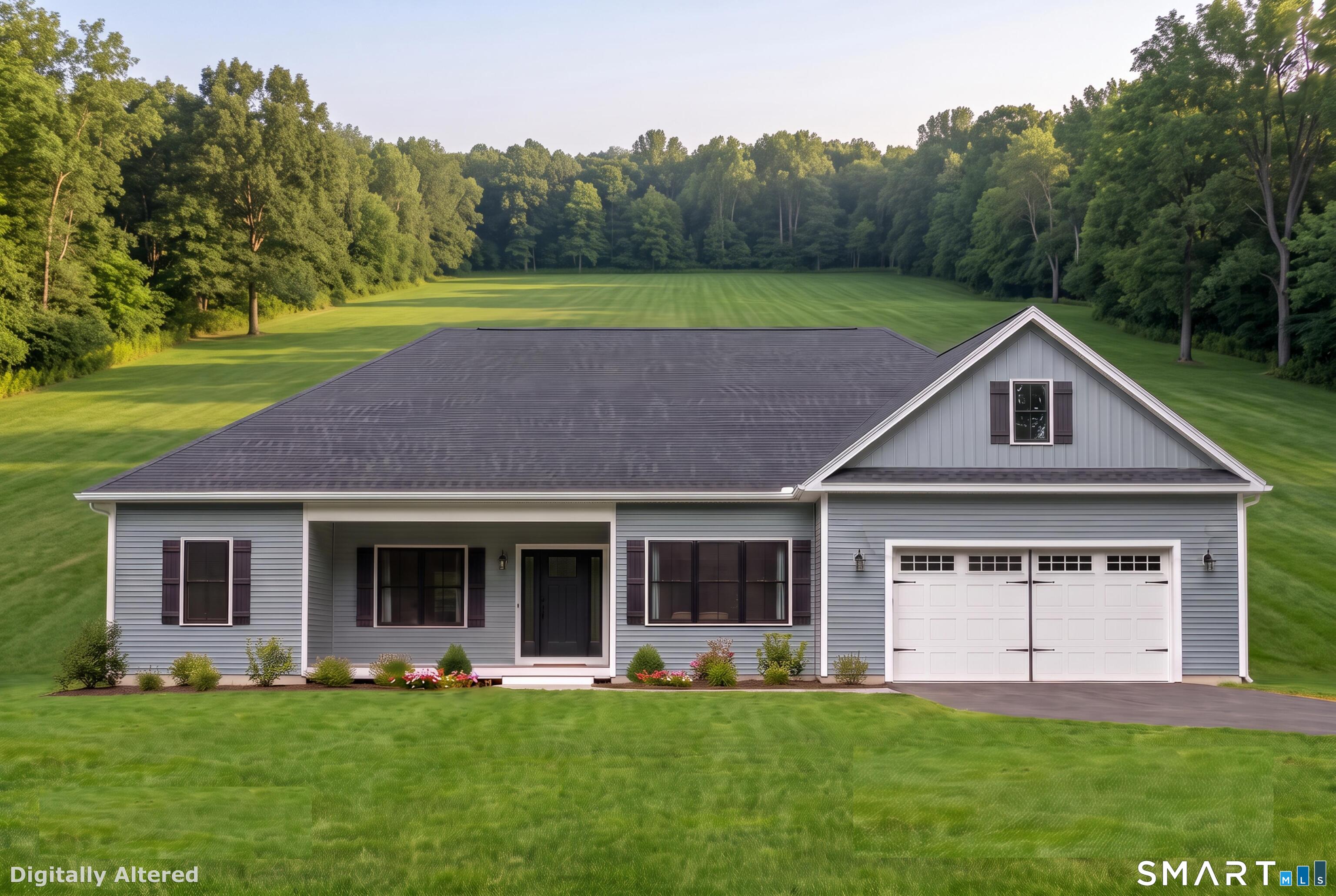 Gray single-story house with a white double garage, broad lawn, and wooded surroundings.