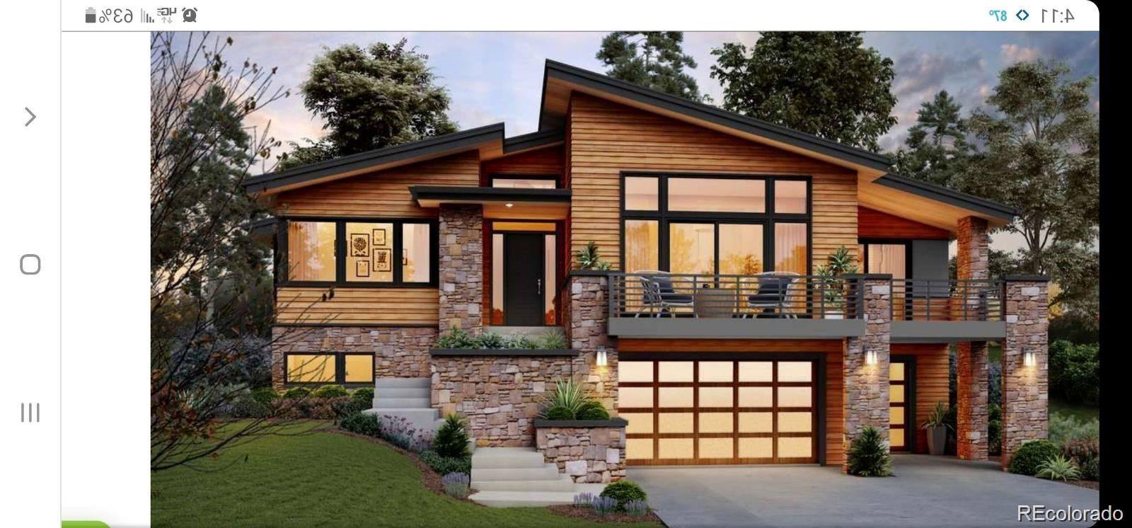 Modern home with wood siding, stone accents, a balcony, and an attached garage.