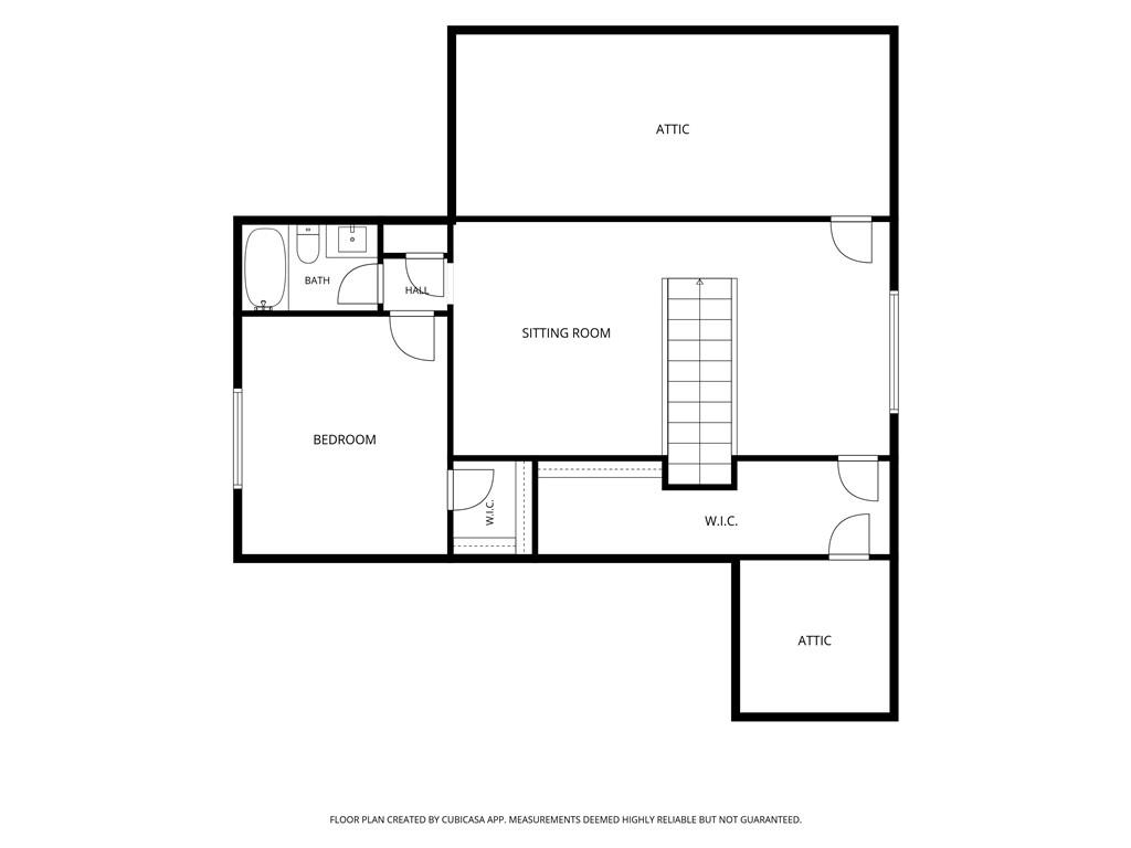 Second-floor plan with a bedroom, bath, sitting room, two walk-in closets, attic areas, and stairs.