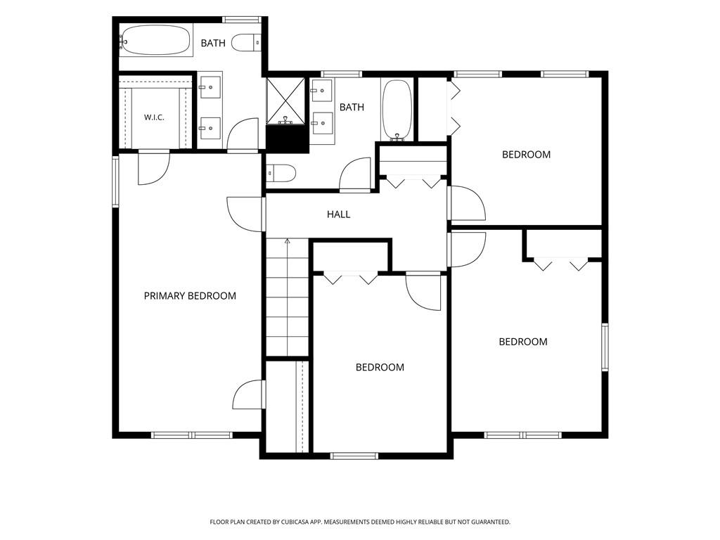Floor plan showing a primary bedroom, three additional bedrooms, two bathrooms, and a central hall.