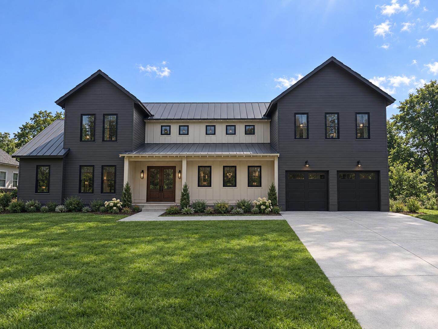 Two-story dark gray house with a cream entry and attached two-car garage.