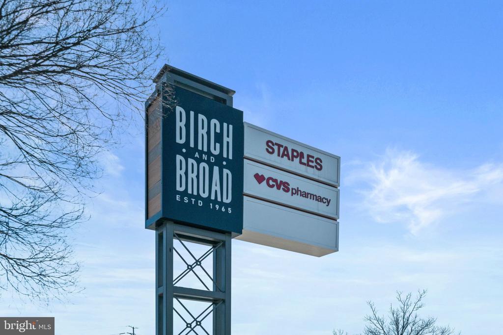 Birch and Broad shopping center sign listing Staples and CVS pharmacy.