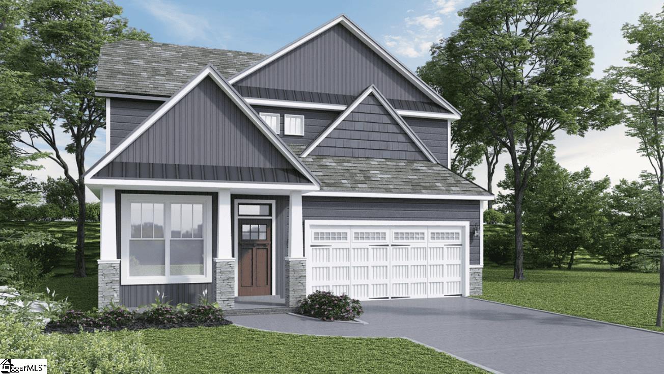 Gray two-story home with multiple front gables, a white double garage door, and a landscaped front yard.