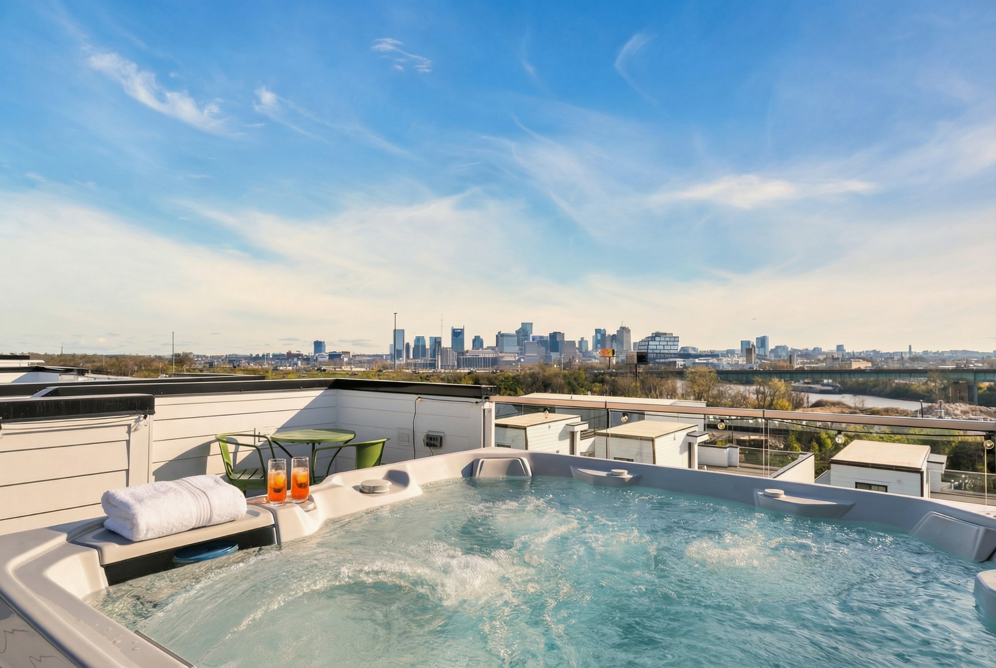Rooftop hot tub with terrace seating and a view of the Nashville skyline.