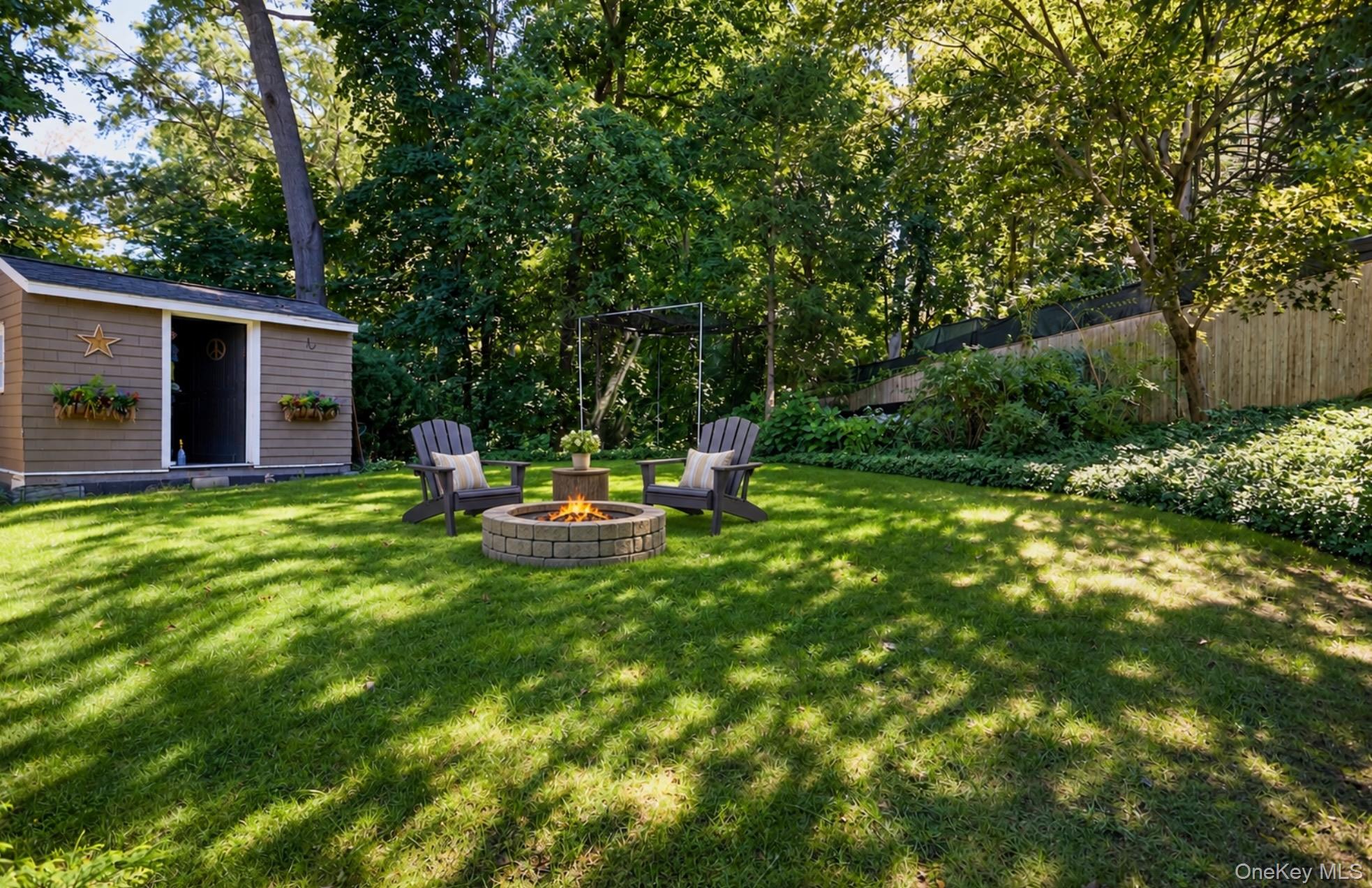 Backyard with a stone fire pit, Adirondack chairs, and a small flower-boxed shed.