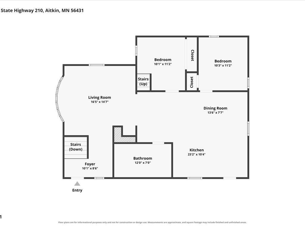 Floor plan showing two bedrooms, living and dining rooms, kitchen, bathroom, foyer, and stairs.