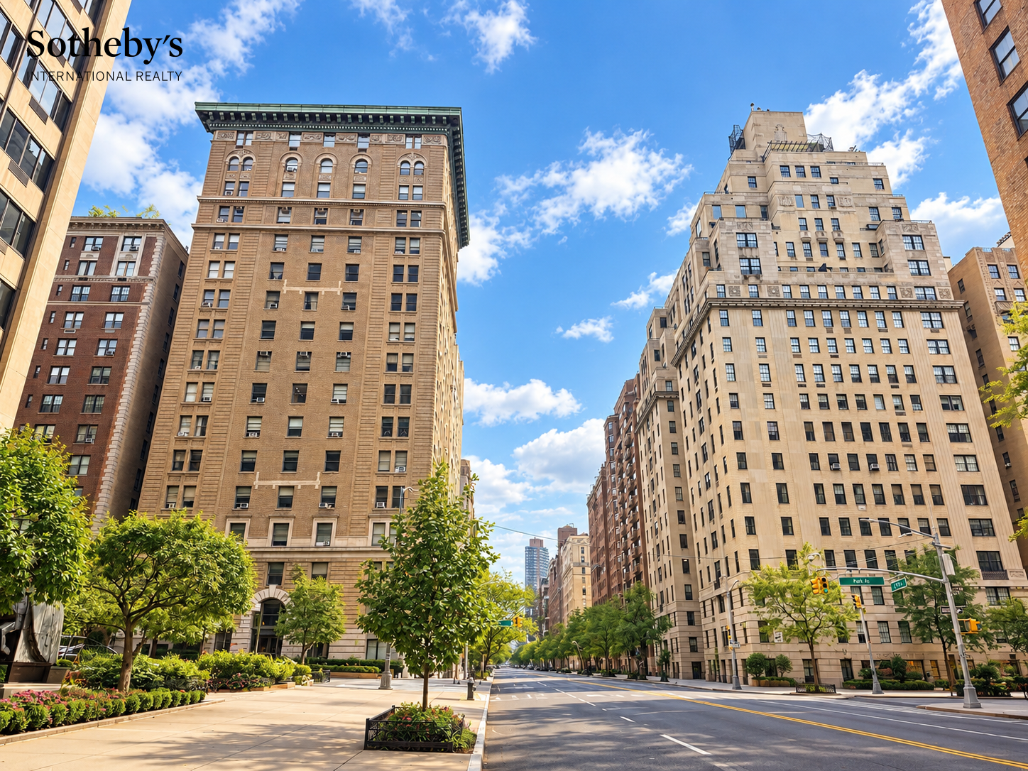 Tree-lined Manhattan avenue framed by historic apartment buildings beneath a bright blue sky.