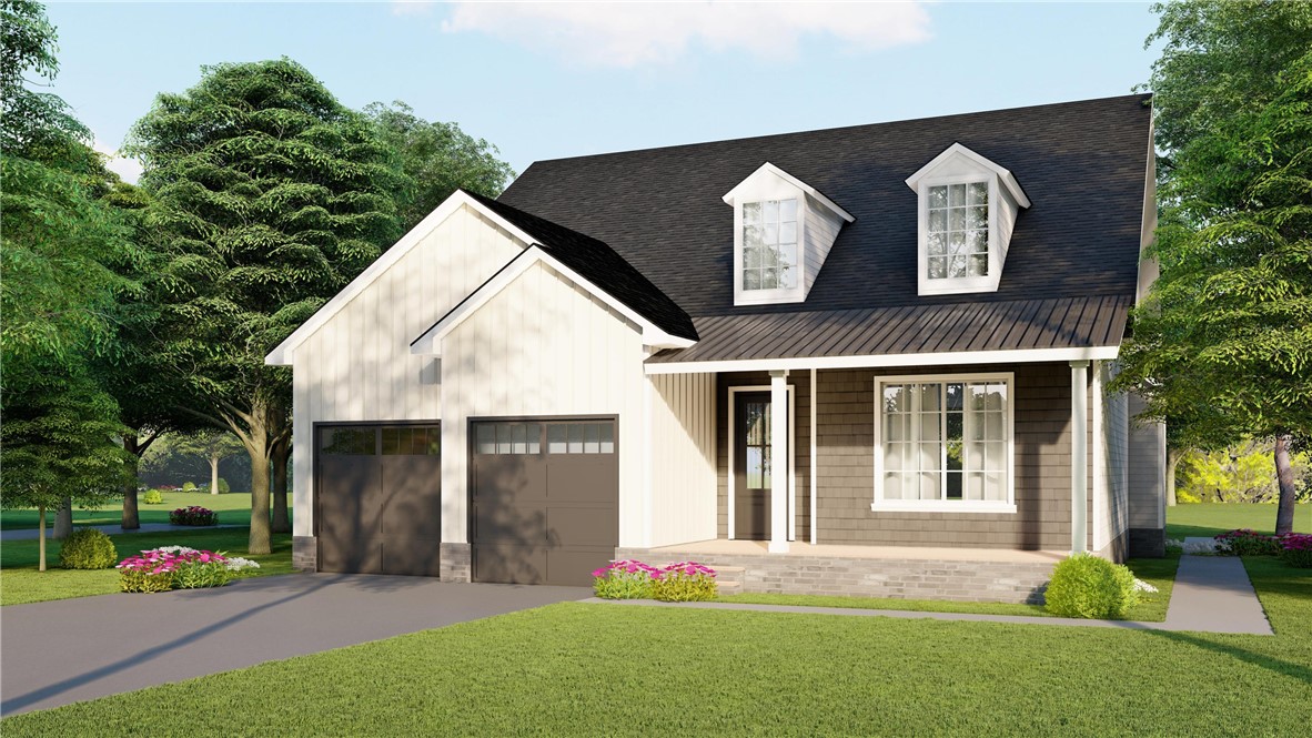 Two-story house with two-car garage, dormer windows, covered porch, and landscaped front lawn.