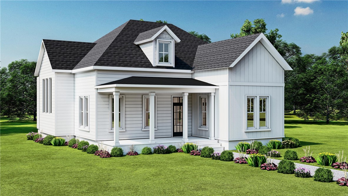 White house with dark shingle roofs, a covered porch, and landscaped front lawn.