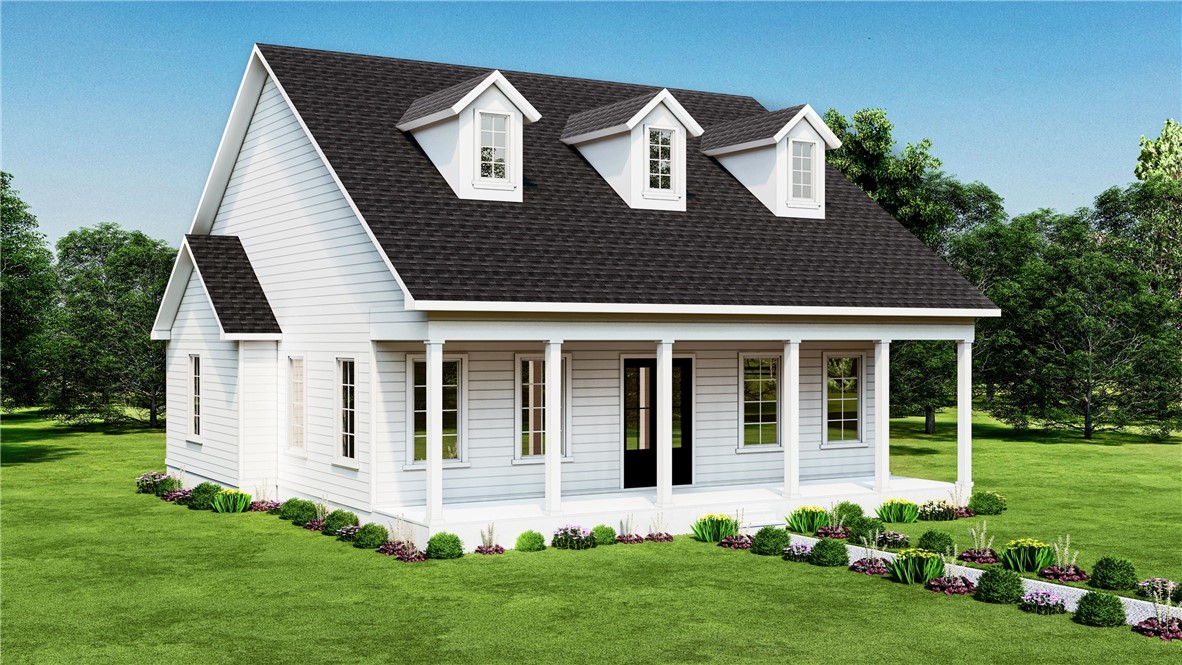 White home with three roof dormers, a covered porch, and landscaped lawn.