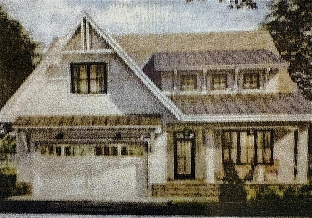 Two-story house with a steep gabled roof, covered porch, and attached garage.