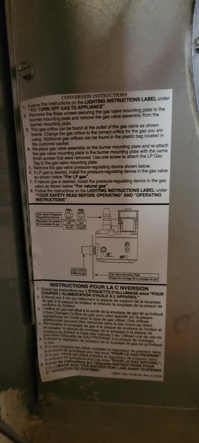 Gas appliance conversion label with English and French instructions and a gas valve diagram.