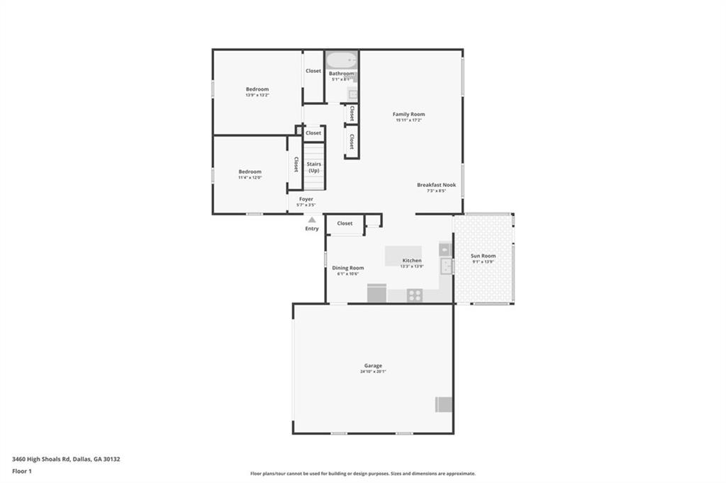 First-floor plan with two bedrooms, kitchen, sun room, and attached garage.
