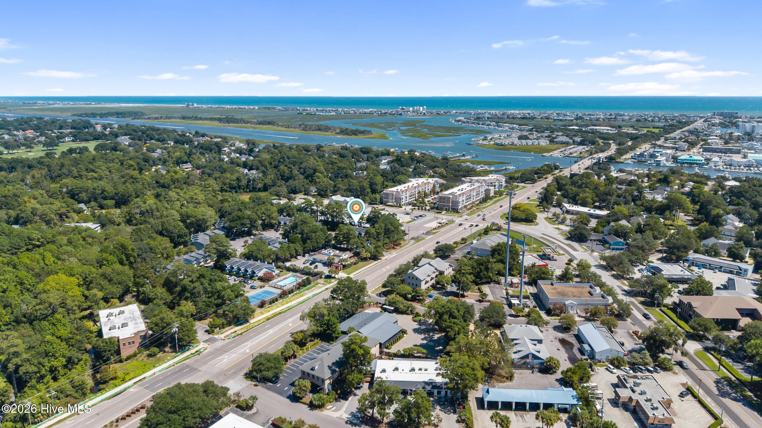 Aerial view of the property area near a coastal inlet and ocean, marked with a location pin.