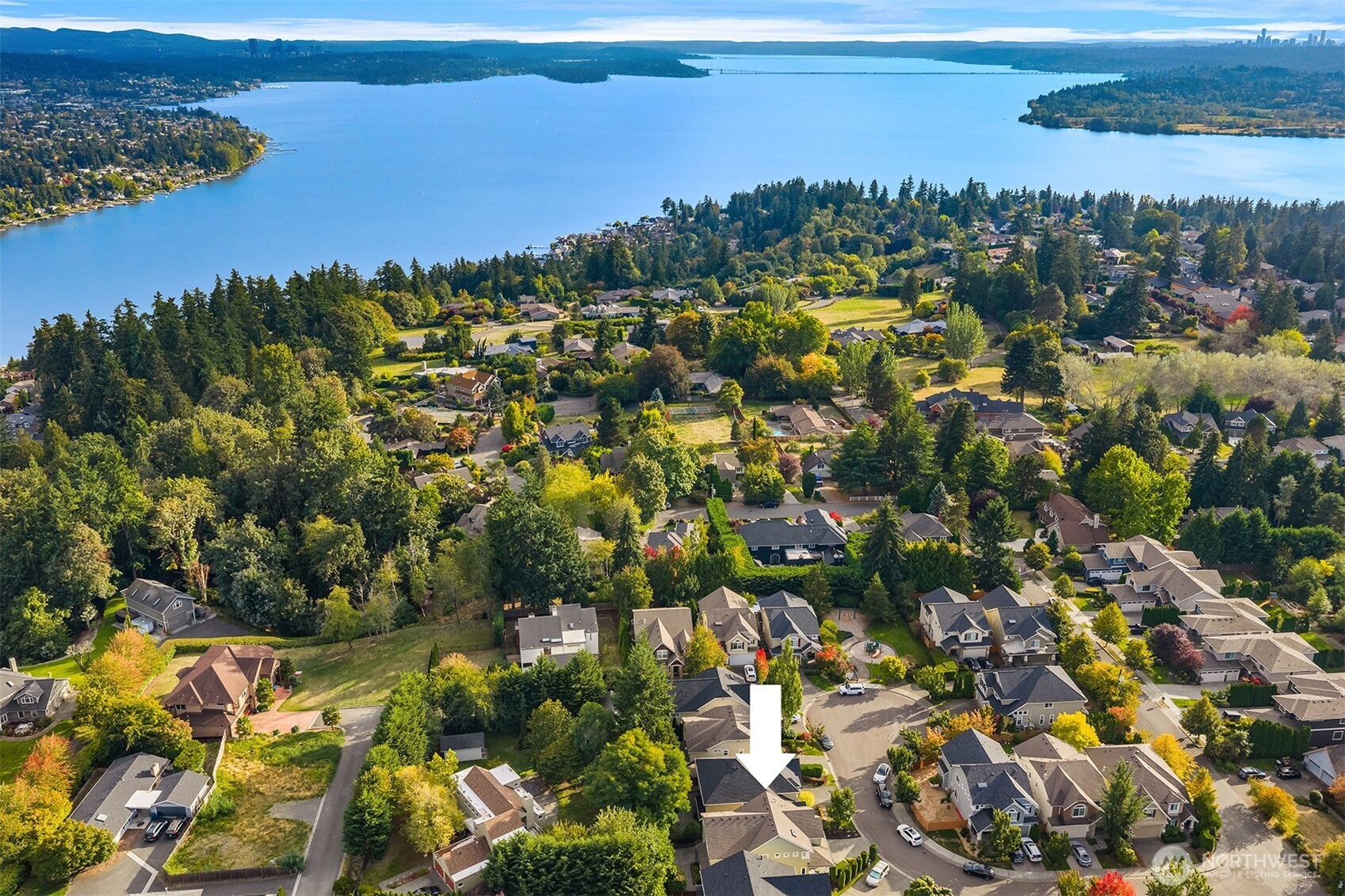Aerial view of a Kirkland neighborhood, with an arrow marking a home near the lake.