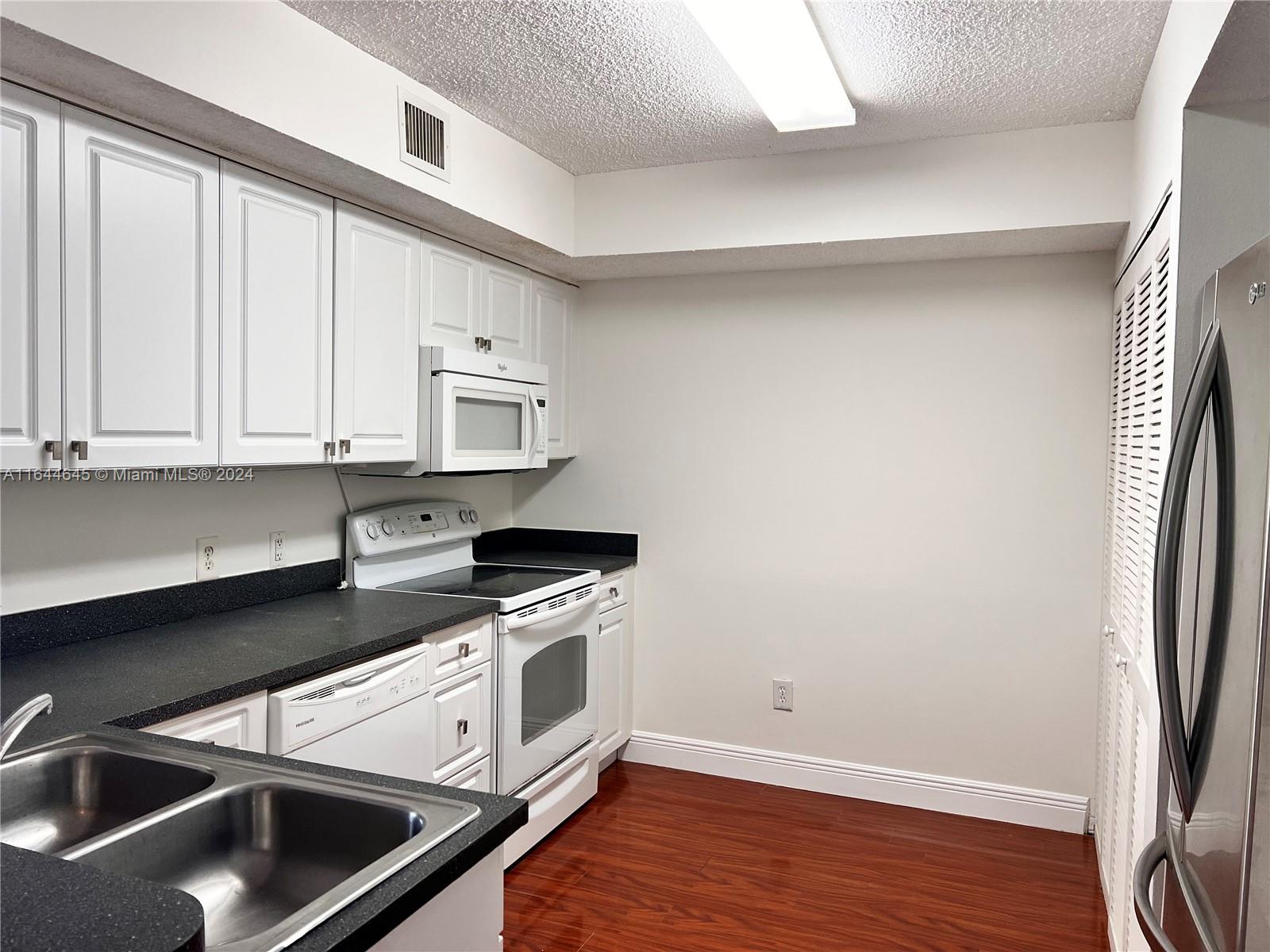 9645 NW 1st Ct # 208 Unit: 1-208